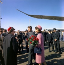 President and Mrs. Kennedy greeting well-wishers. Note the Pan Am 707 in background. (Cecil Stoughton photo)