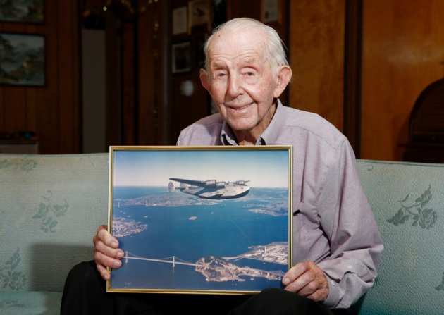 Gerry Mayhan, 99, holds a photograph of a Clipper airplane, circa 1939, at his home in Los Gatos, Calif., on Tuesday, Jan. 13, 2015. (Gary Reyes/Bay Area News Group)